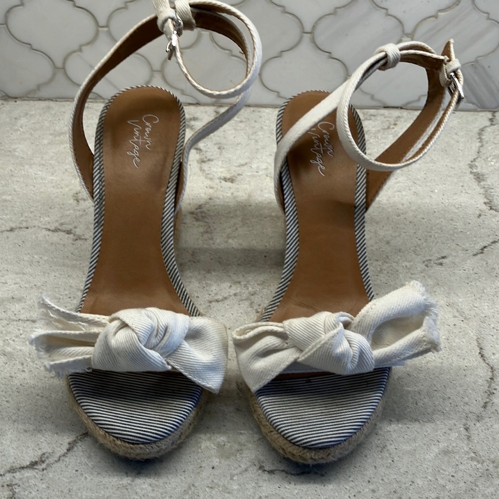 Crown Vintage ivory ankle wrap wedge with cork heel.